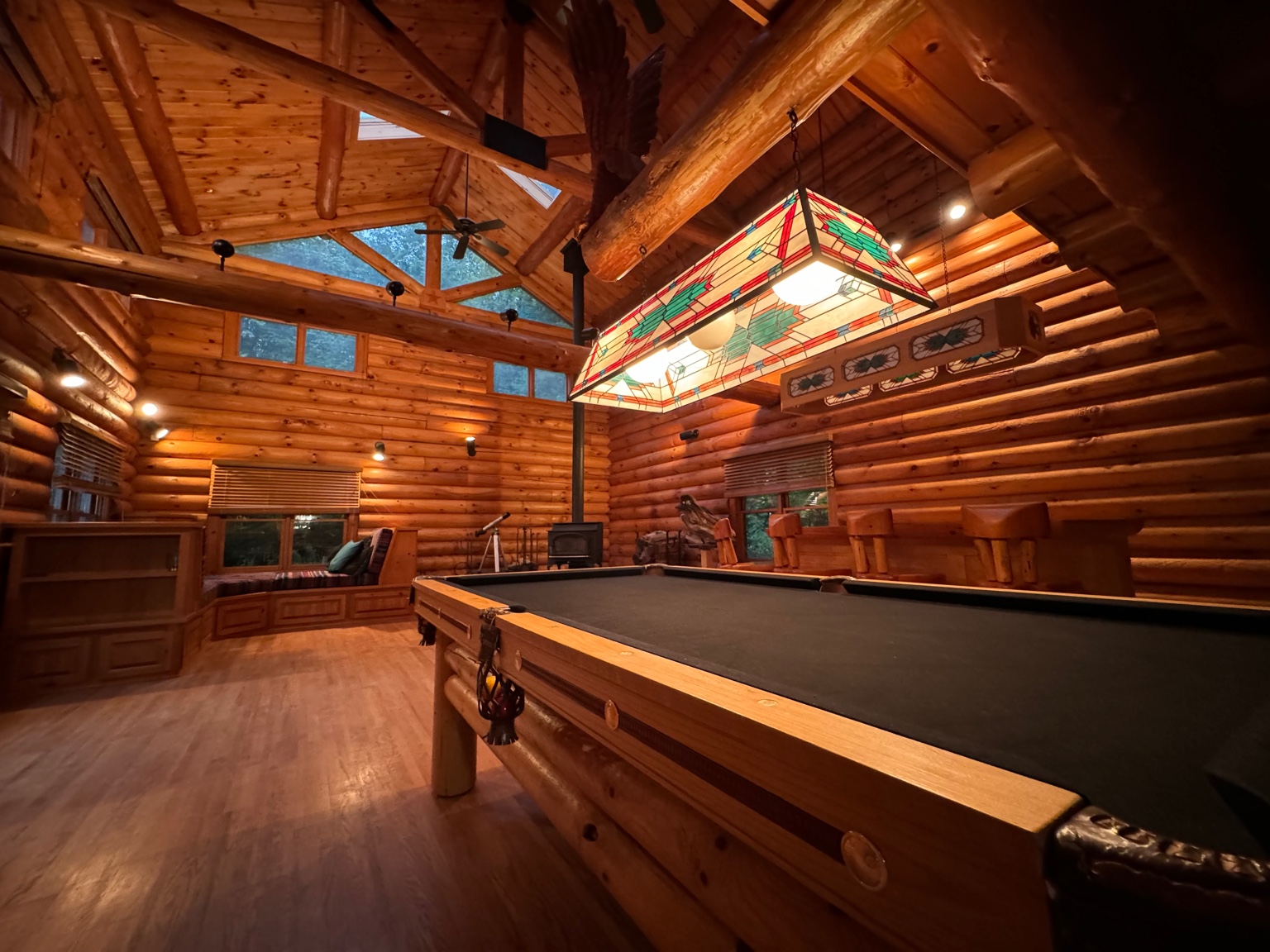 Wide view of game room and pool table