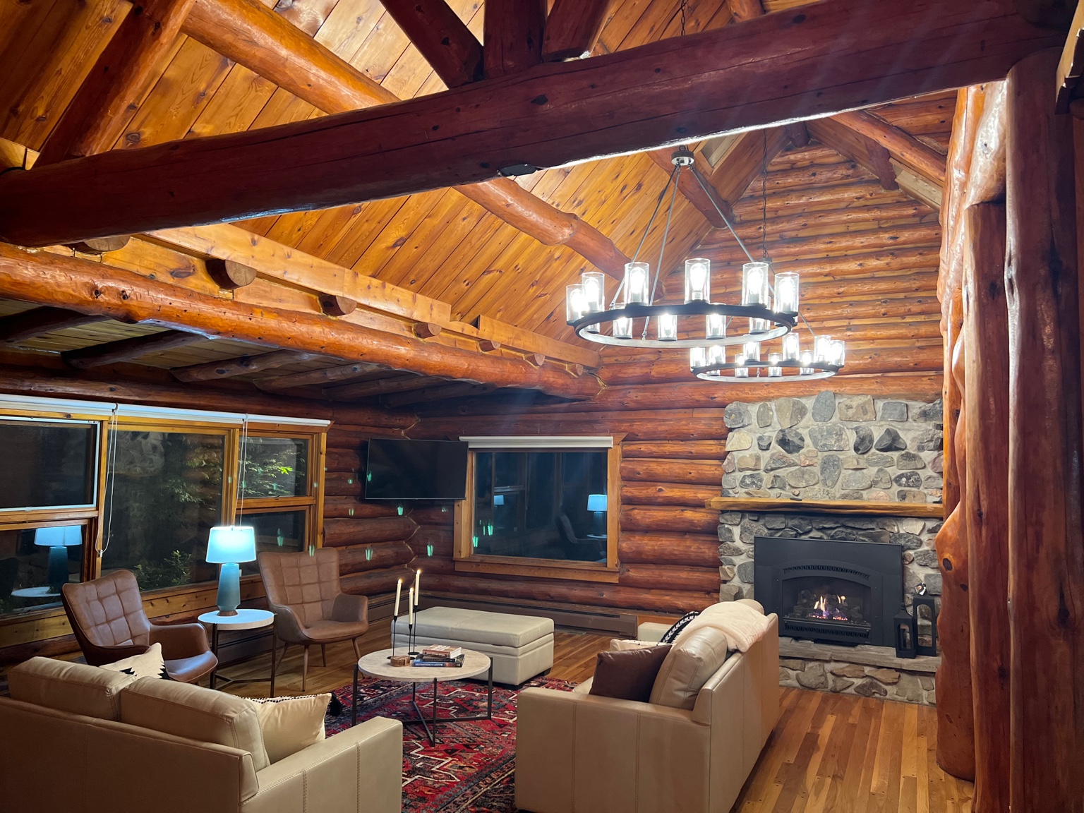 Living room with fireplace and chandeliers