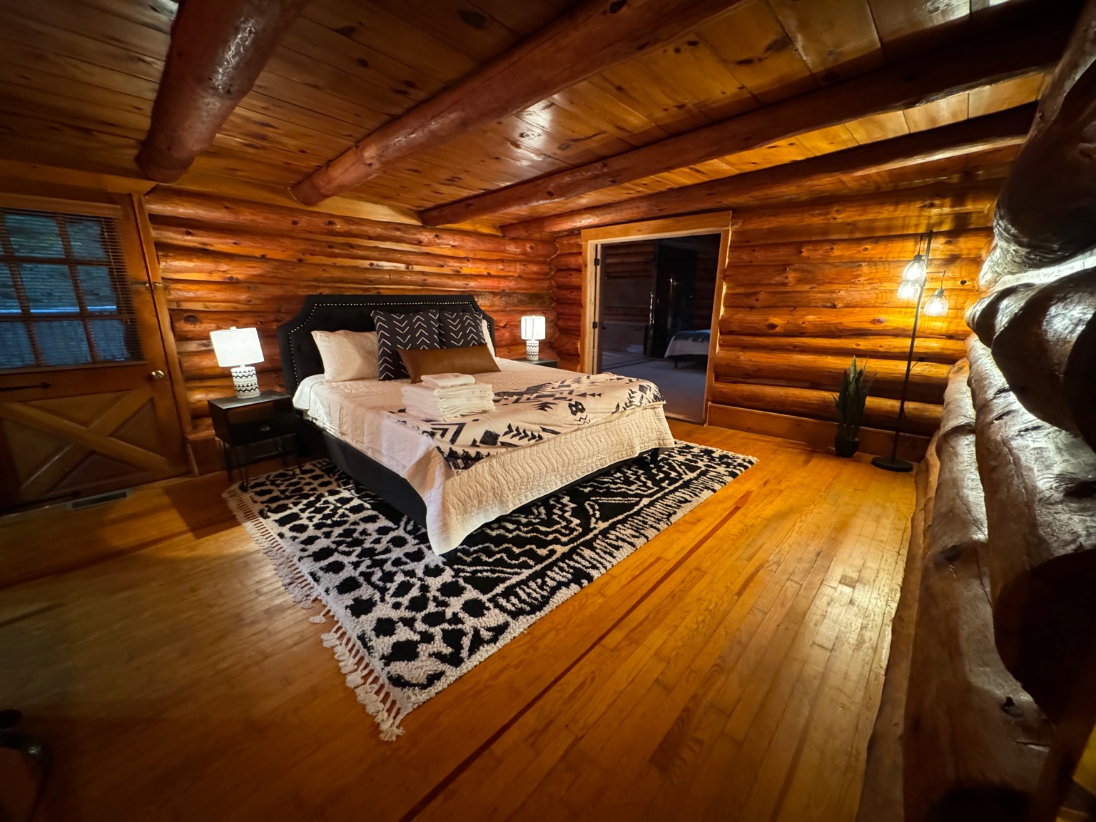 Primary bedroom with king bed and cozy lighting